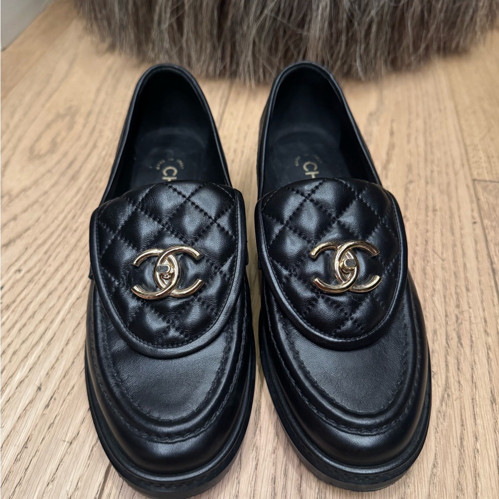 CHANEL Black Quilted Loafers with Gold Logo